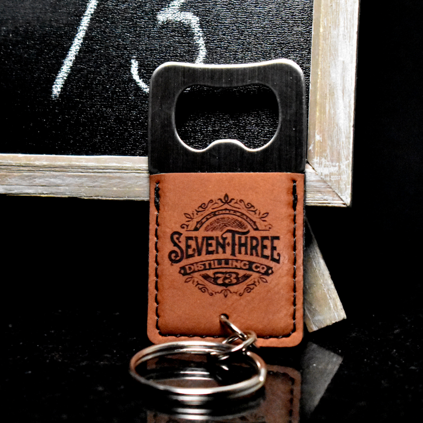 Wholesale engraved Square Cognac Keychain Bottle Opener customized with Seven Three Distillery logo