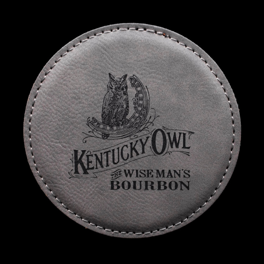 Wholesale engraved Gray Round Coaster customized with Kentucky Owl logo on a black background