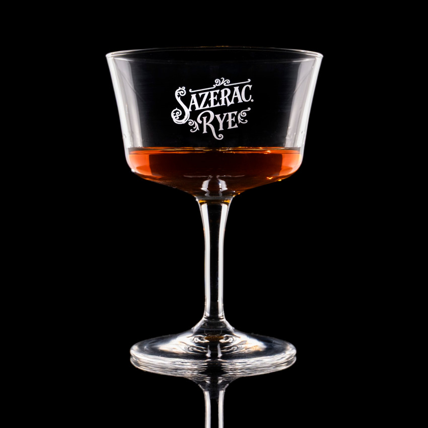 Wholesale engraved 7.5 oz. Bartender Fizz Glass customized with Sazerac Rye logo on a black background