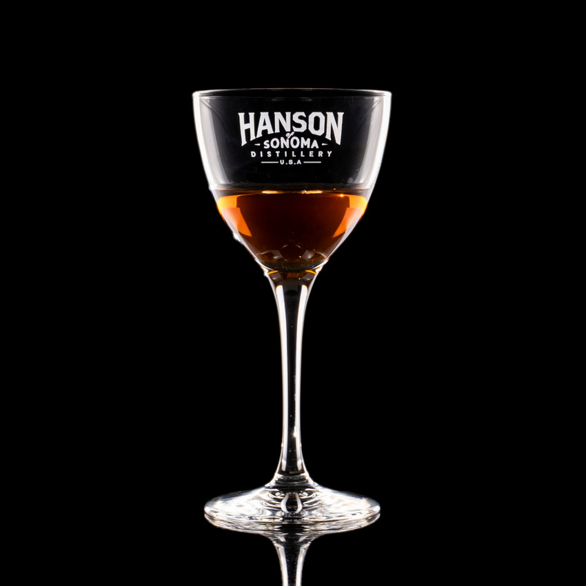 Wholesale engraved 5.25 oz. Nick & Nora Glass customized with Hanson Distillers logo on a black background