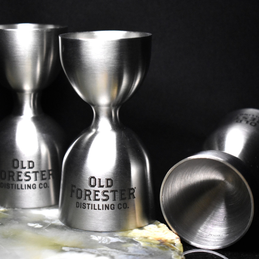 Wholesale engraved Vintage Jigger customized with Old Forester logo on a black background
