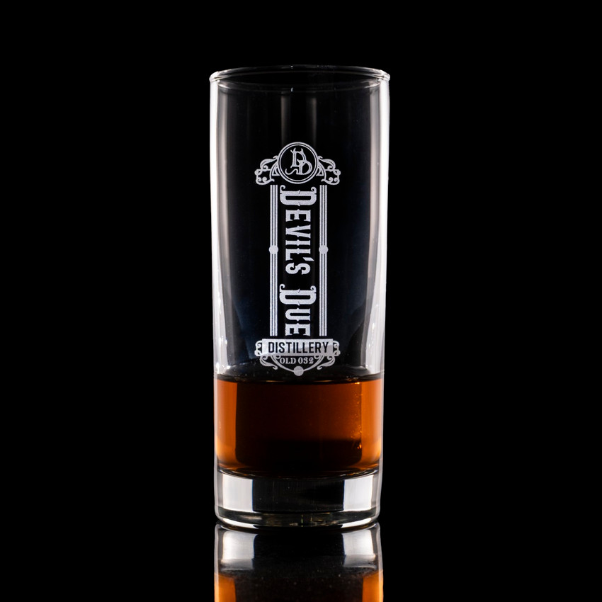 Wholesale engraved 10.5 oz. Lexington Highball Glass customized with Devils Due Distilling logo on a black background