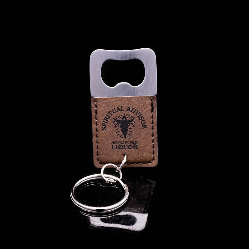 Wholesale engraved Square Rum Keychain Bottle Opener customized with Seven Three Distillery logo on a black background