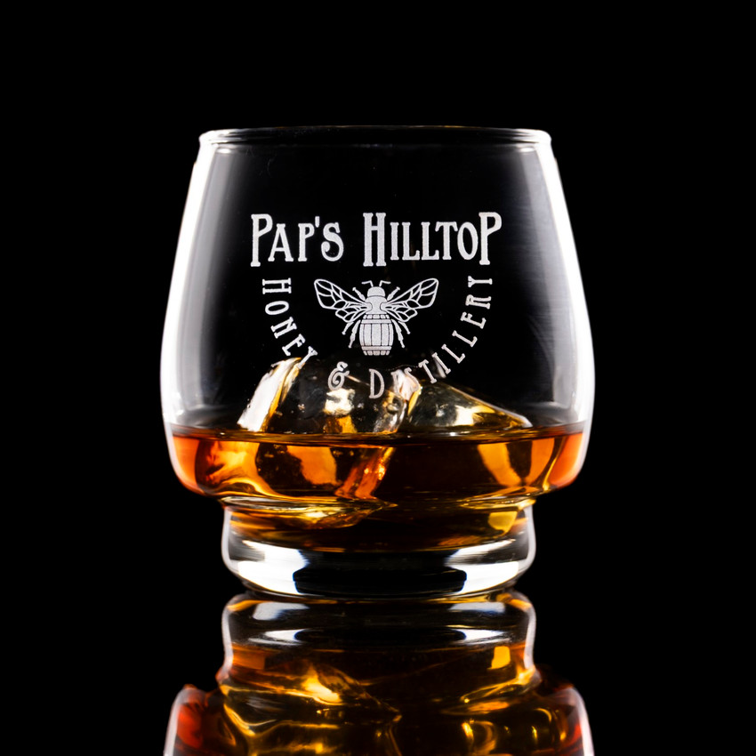 Wholesale engraved 10 oz. Single Barrel Select Rocks Glass customized with Paps Hilltop Distillery logo on a black background