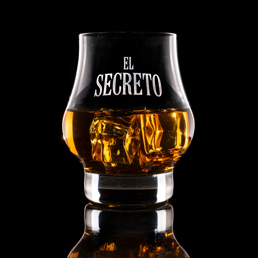 Wholesale engraved 8.5 oz. Masters Reserve Glass customized with El Secreto logo on a black background
