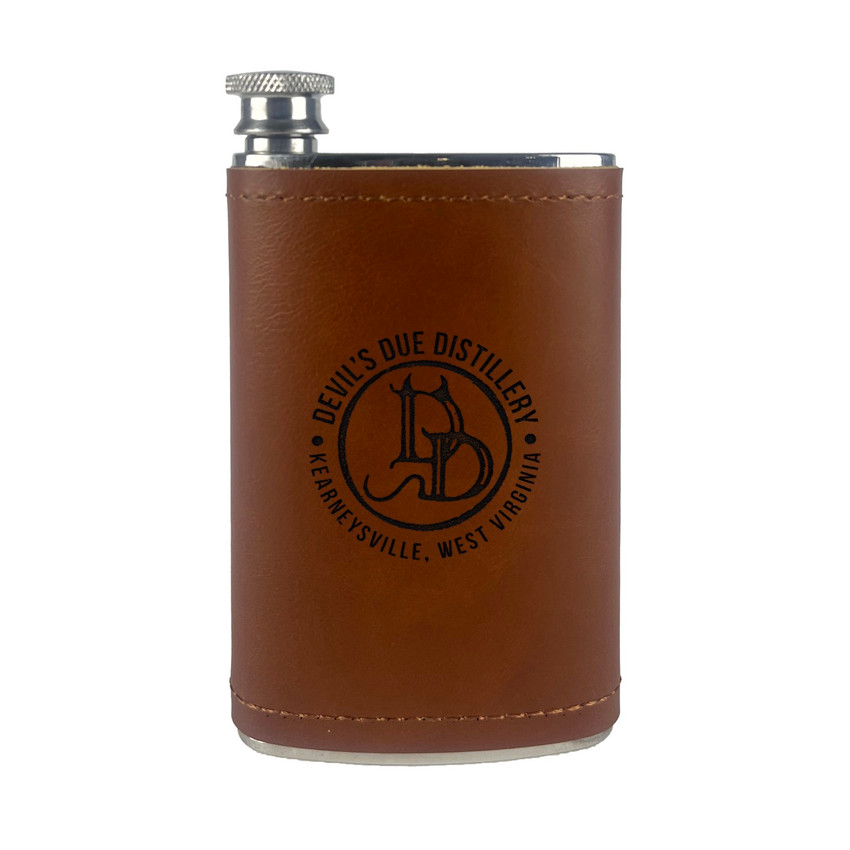 Wholesale engraved 5 oz. Aged Cognac Leather Field Flask customized with Devils Due Distillery logo on a white background