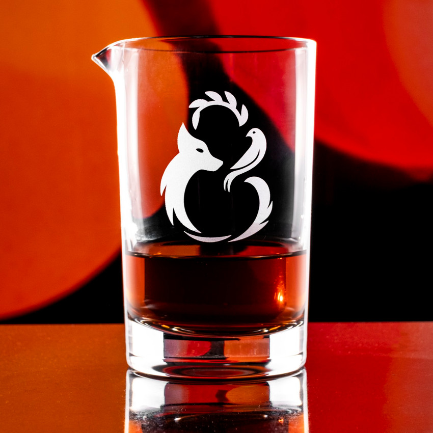 Wholesale engraved Cristallo Mixing Glass customized with Fierce & Kind Logo on a bokeh background