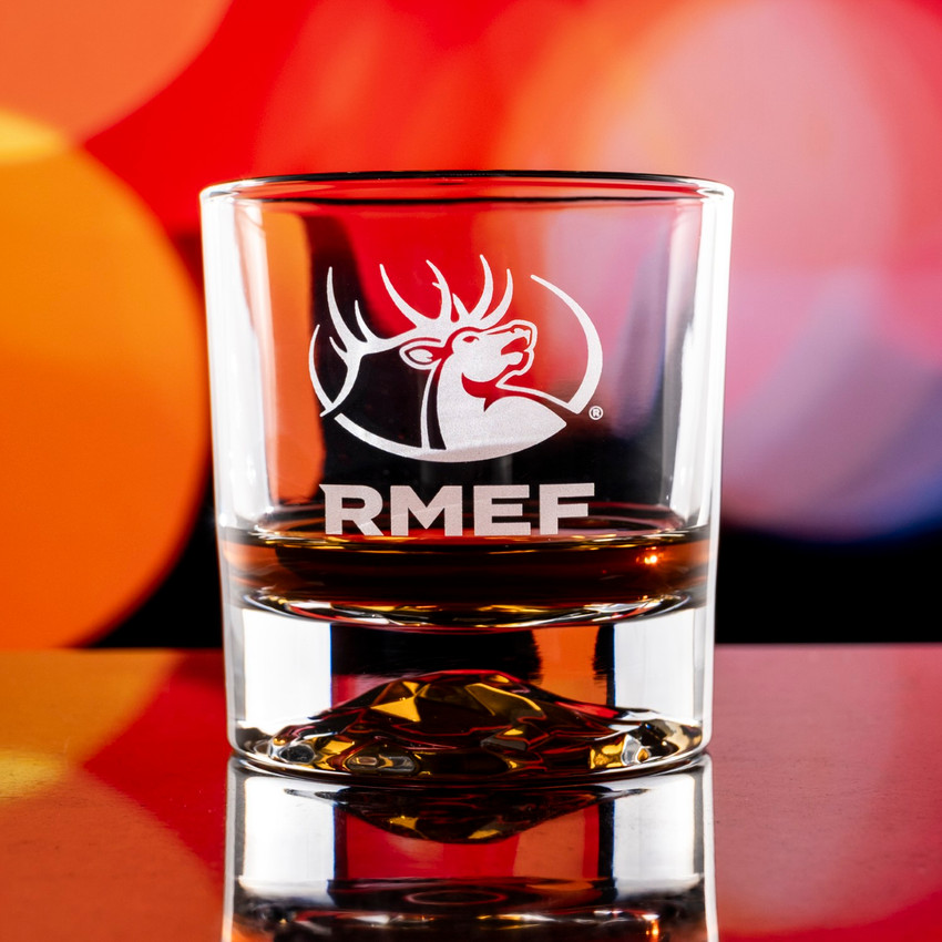 Wholesale engraved 10 oz. Aeneas Rocks Glass customized with RMEF logo on a bokeh background