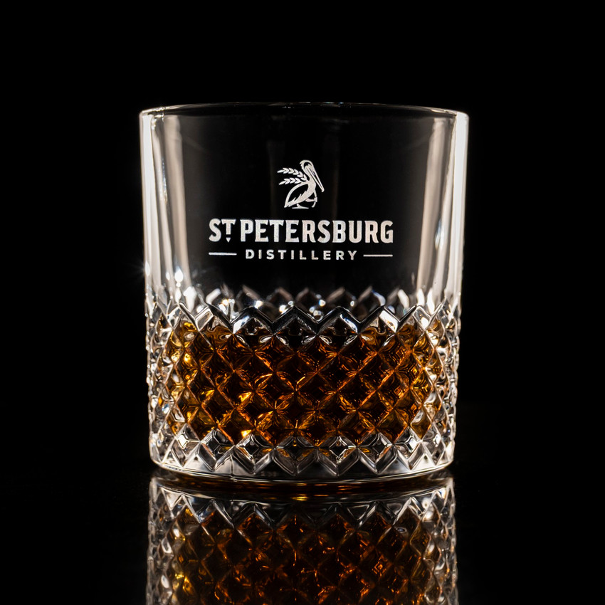 Wholesale engraved 11.5 oz. Carats Rocks Glass customized with St Petersburg Distillery logo on a black background