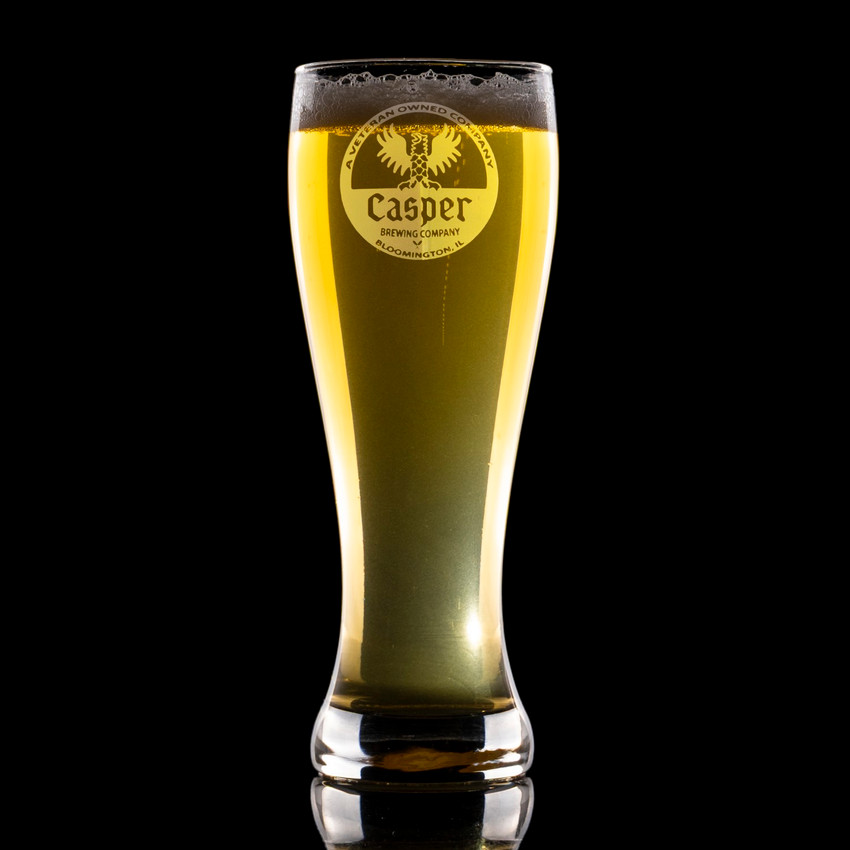 Wholesale engraved 23 oz. Pub Pilsner Glass customized with Casper Brewing logo on a black background
