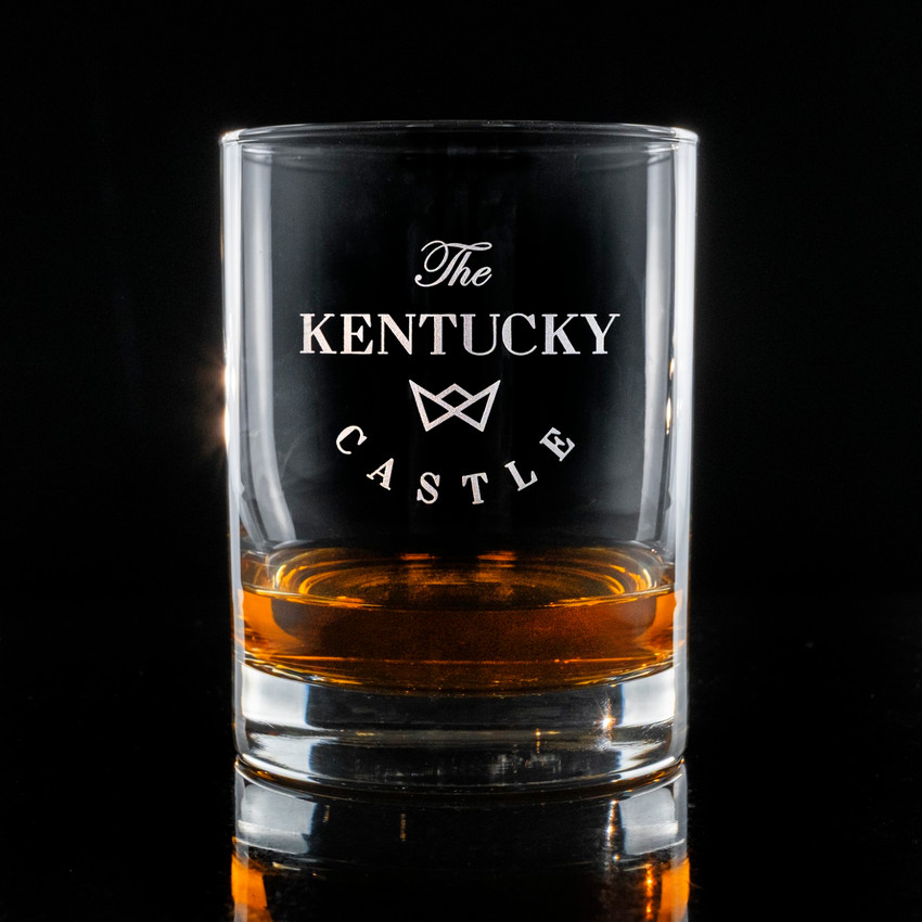 Wholesale engraved 14.25 oz. Stolzle New York Rocks Glass customized with The Kentucky Castle logo on a black background