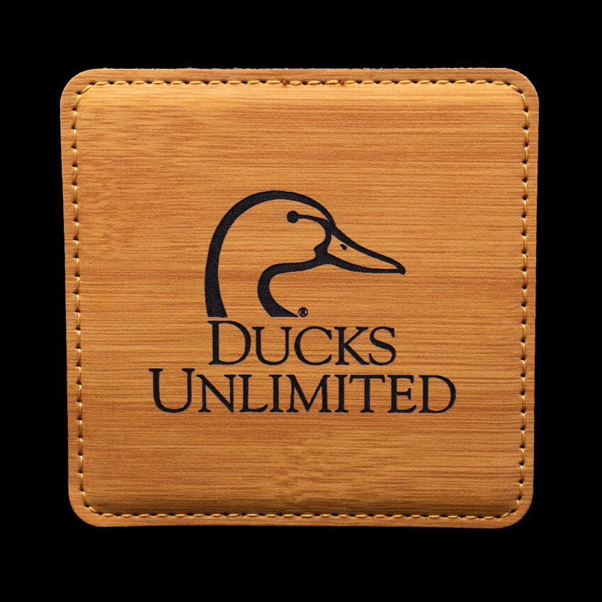 Wholesale engraved Golden Wheat Square Coaster customized with Ducks Unlimited logo on a black background