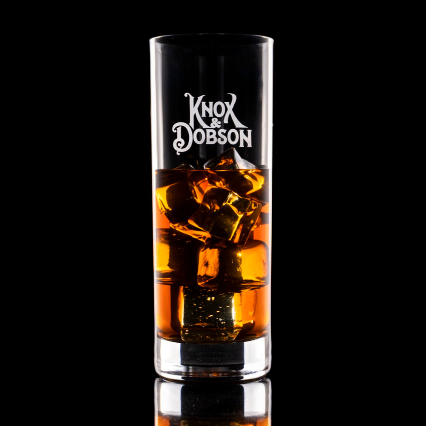 Wholesale engraved 15.25 oz. Stolzle New York Highball Glass customized with Knox Dobson logo on a black background