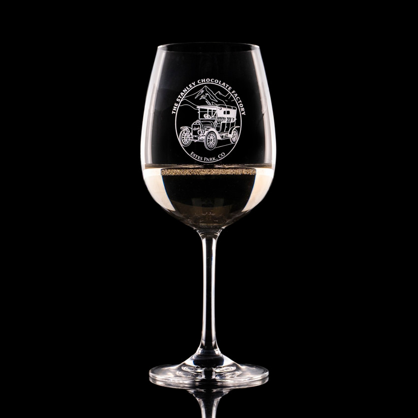 Wholesale engraved 15 oz. Stolzle Weinland Wine Glass customized with The Stanley Chocolate Factory logo on a black background