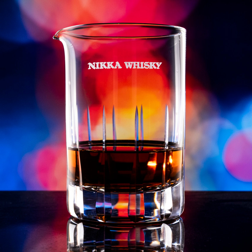 Wholesale engraved Noble Mixing Glass customized with Nikka Whisky logo on a bokeh background