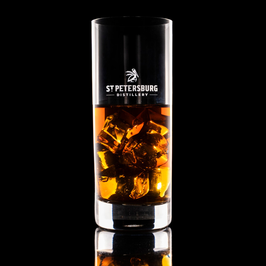 Wholesale engraved 14.25 oz. Stolzle New York Collins Glass customized with St Petersburg Distillers logo on a black background