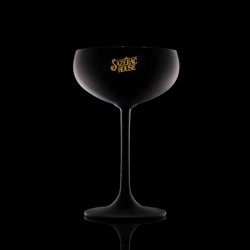 Wholesale engraved Stolzle Black & Gold Glisten Coupe Glass customized with Sazerac House logo on a black background