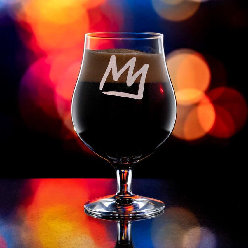 Wholesale engraved 16.75 oz. Stolzle Berlin Beer Glass customized with Mammoth Mountain logo on a bokeh background