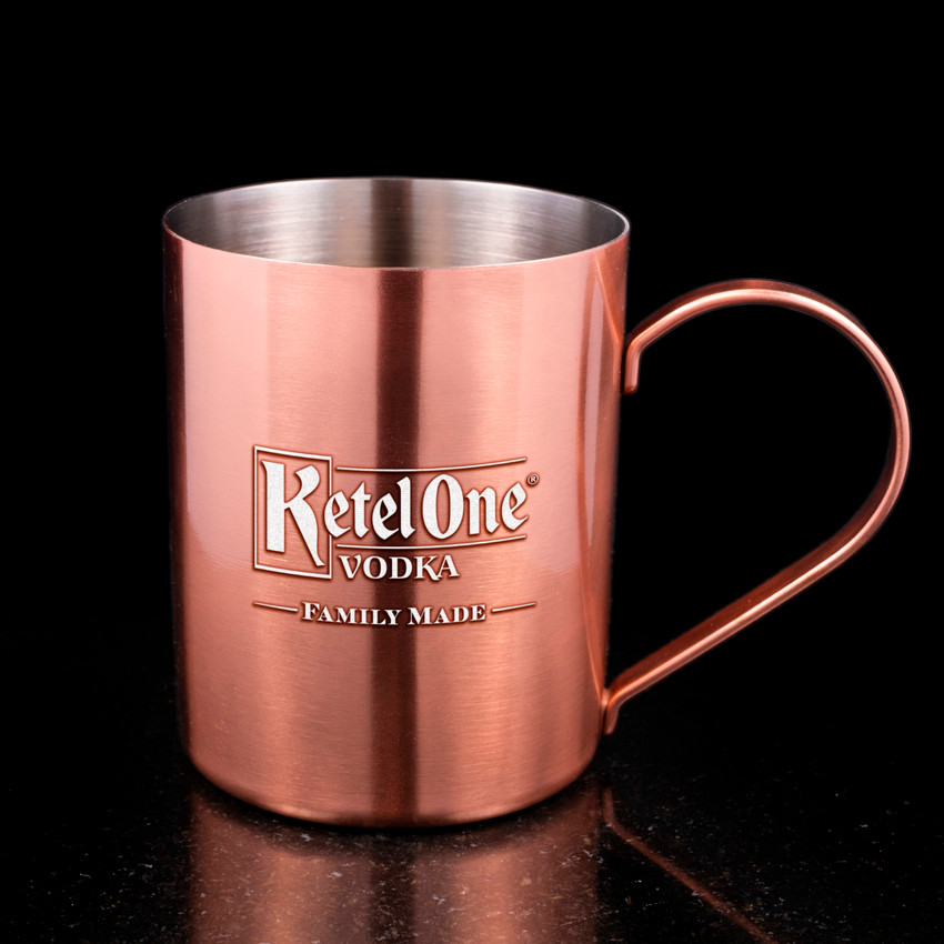 Wholesale engraved Copper Camp Mugs customized with Ketel One logo on a black background