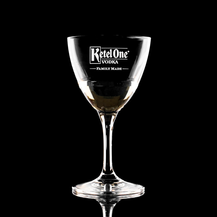 Wholesale engraved 5.75 oz. Stolzle Nick & Nora Glass customized with Ketel One logo on a black background