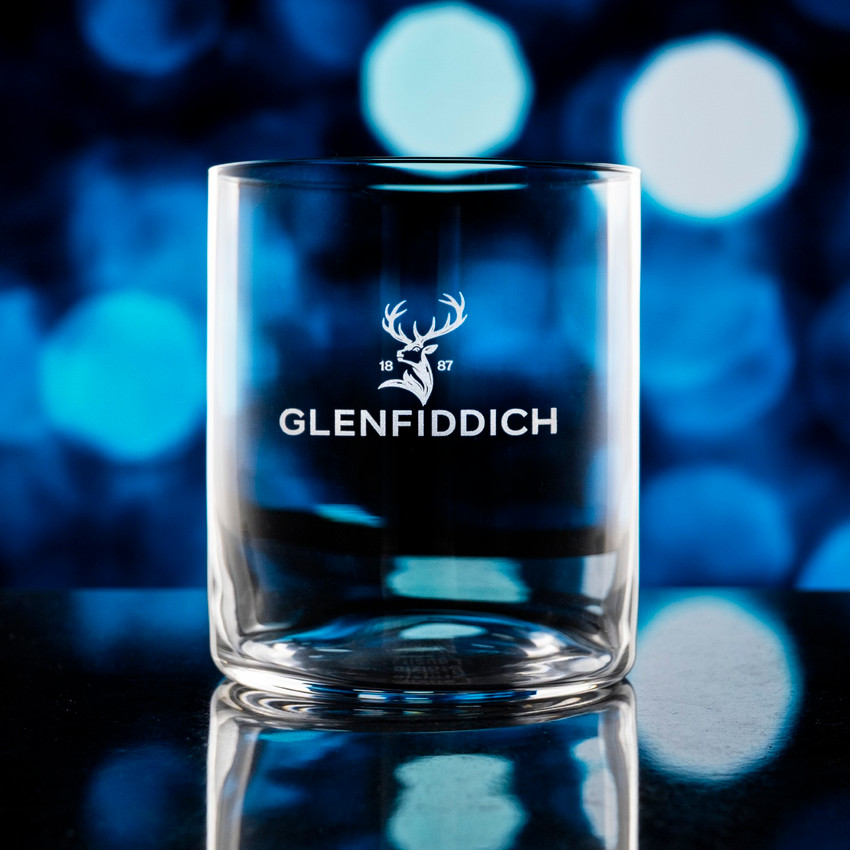 Wholesale engraved 14.5 oz. Stolzle Kyoto O.F. Rocks Glass customized with Glenffidich logo on a bokeh background