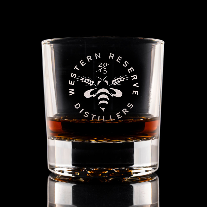 Wholesale engraved 10.5 oz. Nob Hill Rocks Glass customized with Western Reserve Distillers logo on a black background