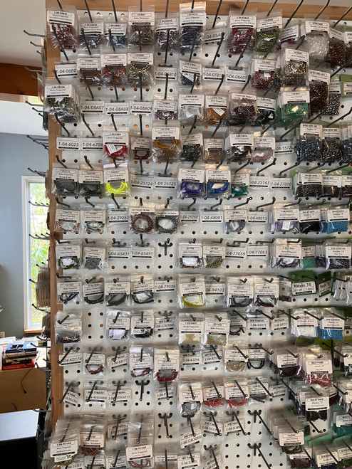 Firepolish 4mm beads on a shelf