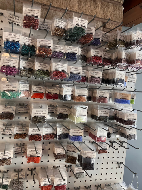 Teacup beads on a pegboard shelf