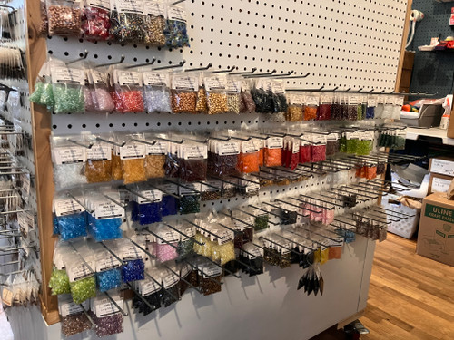 Long Magatamas on a pegboard shelf