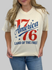 Person wearing a t-shirt with 'America 76 Land of the Free' design.