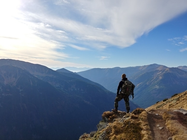 man-hiking-camo-pants-backpack.jpg