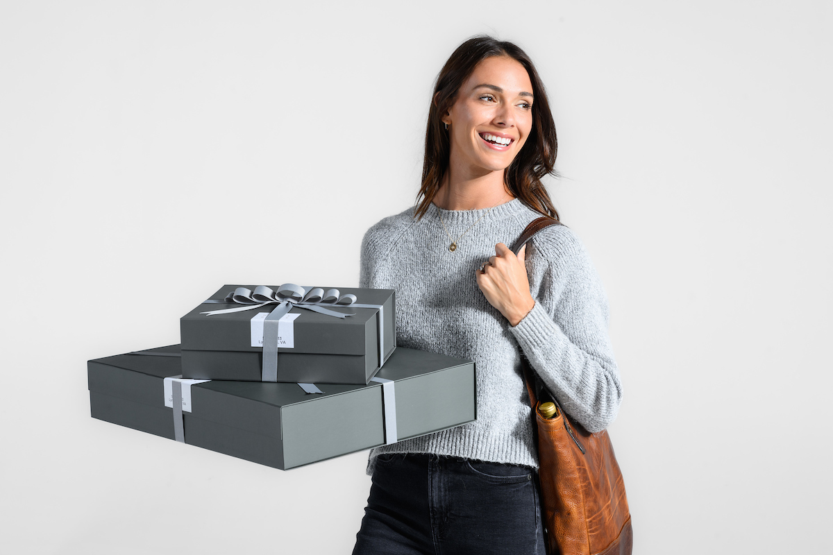 Woman holding carbon neutral shipped items