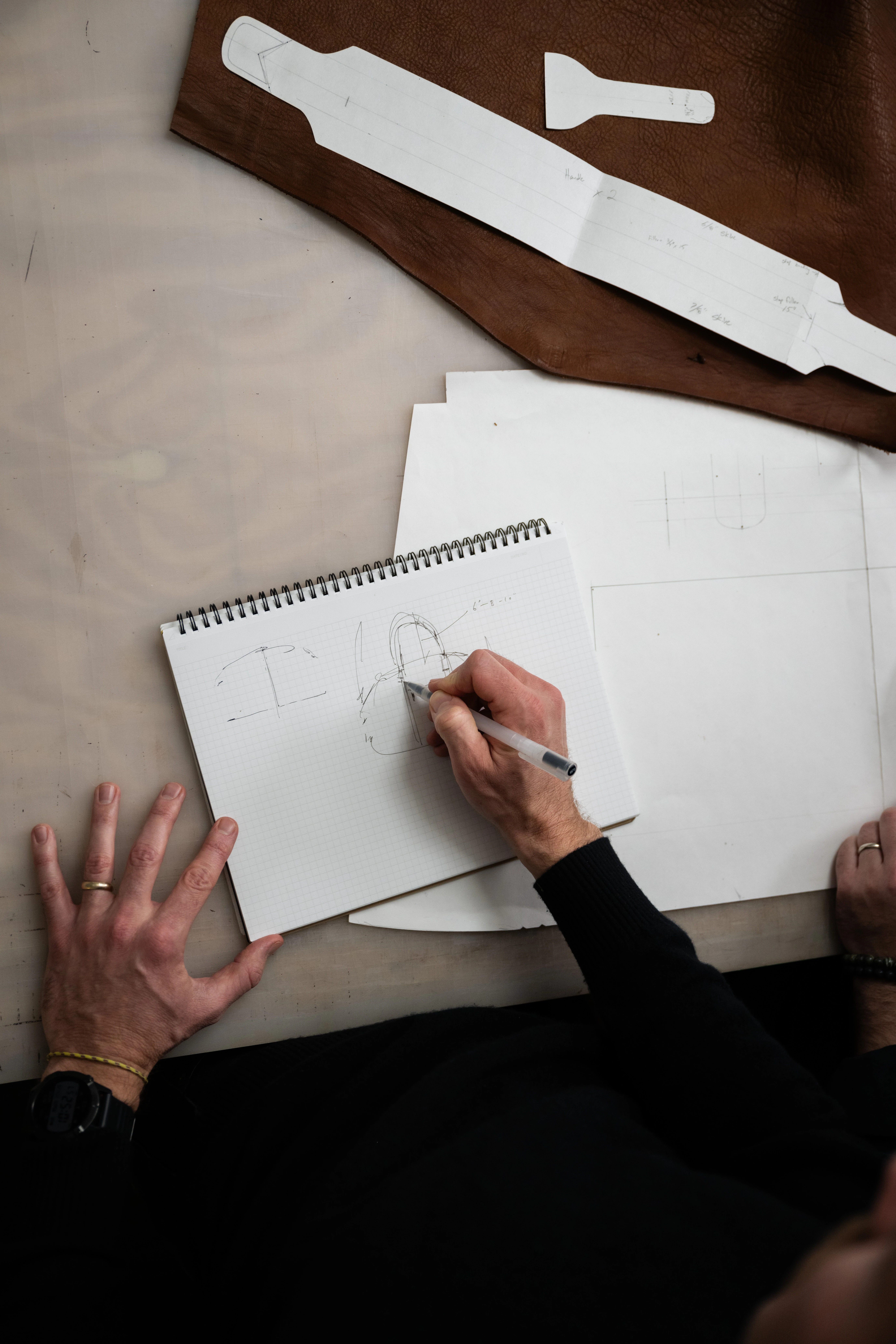 Moore and Giles design process, sketching leather goods alongside leather patterns
