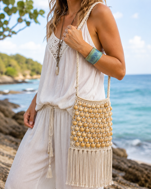 Woman wearing green and blue ocean wave cuff bracelet with macrame bag