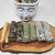 White ceramic Buddha Planter filled with smudge sticks and palo santo