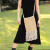 Fair trade cotton macramé tote bag with wooden beads, boho beach-style design, called The Intention Bag, perfect for spiritual living