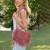 Boho raffia crossbody bag with fringe detail, zipper closure, and inner lining – natural woven purse for summer or festival wear