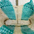 Inside of Turquoise striped woven jute beach bag with natural fiber handles