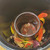 Inside the Black Ceramic Chakra Smudge Pot with swirling chakra colors and symbols with a Dragon's Blood Smudge Stick