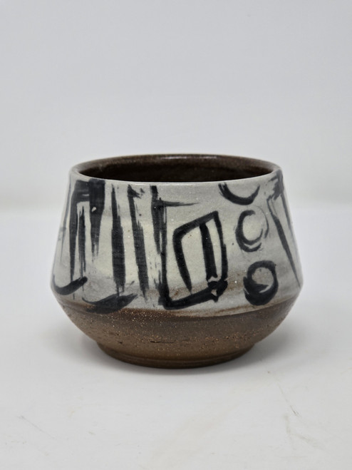 Tea bowl made of red stoneware, and hand painted.