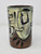 Ceramic tumbler made of red stoneware and hand painted.