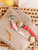 Kikadu - Organic Schnullerkette Musselin Himbeere