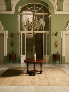 The Rug Company Caliche Silk rug, Olive colourway, styled in an elegant interior