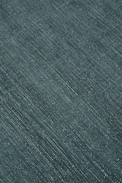Close-up of Vara rug in Aegean, showing silk-wool tactile contrast