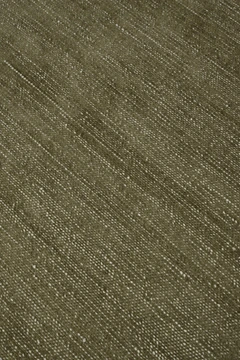 Close-up of Vara rug in Olive, showing silk-wool tactile contrast