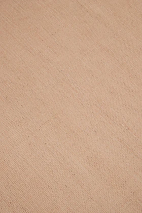 Close-up of Vara rug in Clay, showing silk-wool tactile contrast