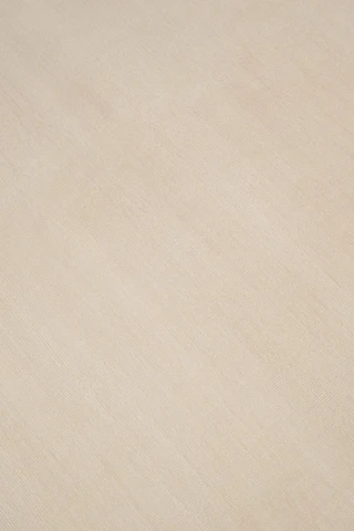 Close-up of Caliche Silk rug in Dawn, showing lustrous silk sheen