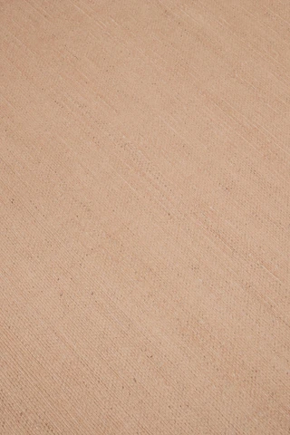 Close-up of Vara rug in Clay, showing silk-wool tactile contrast