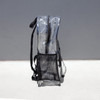 A clear stadium backpack in transparent PVC with black straps and a mesh pocket at the bottom.