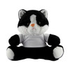 A black and white cat plush toy sitting upright, wearing a plain white shirt with a soft, cuddly texture.